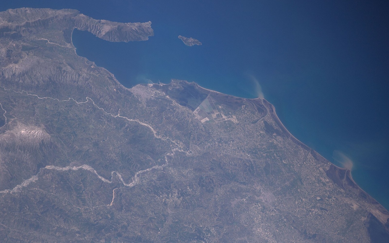 A coastal plain, lagoon and headland seen from orbit